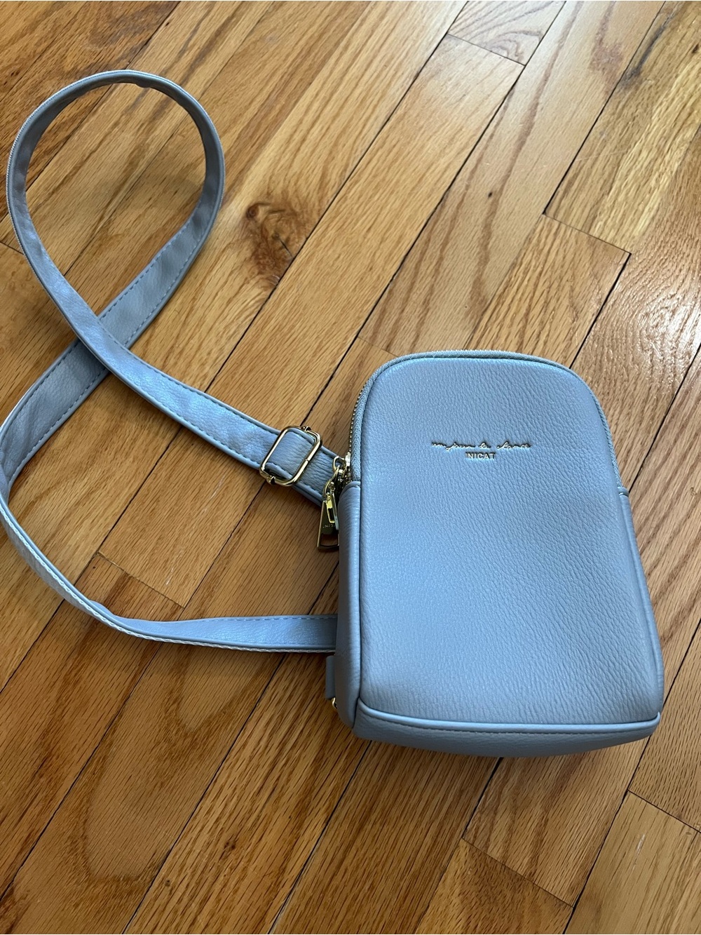 Inicat  Light Blue Pebbled Crossbody Bag with Gold Hardware